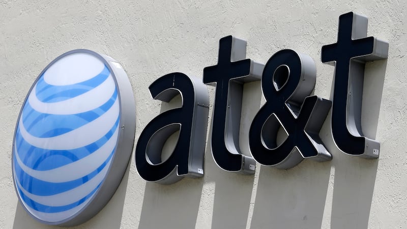 FILE - This July 27, 2017, file photo shows an AT&T logo at a store in Hialeah, Fla. (AP...