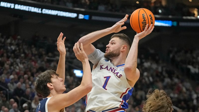 Kansas center Hunter Dickinson (1) shoots as Gonzaga forward Braden Huff (34) defends during...
