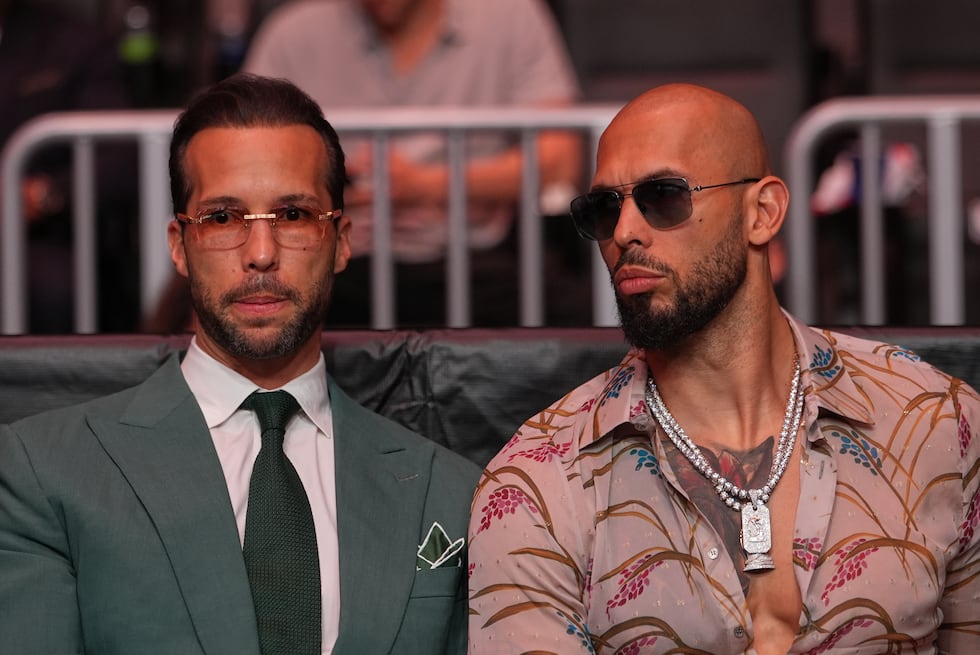 FILE - Andrew Tate, right, and his brother Tristan arrive an event, April 11, 2026, in Miami....