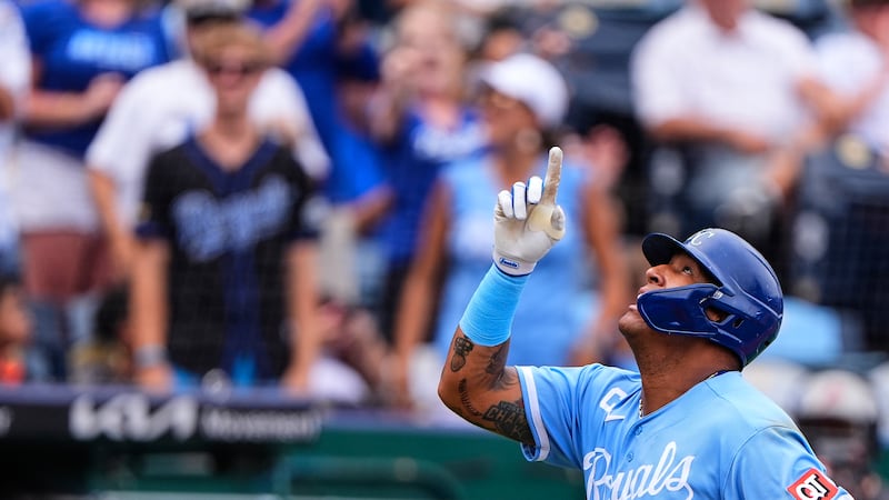 Kansas City Royals' Salvador Perez celebrates after hitting a two-run home run to tie George...