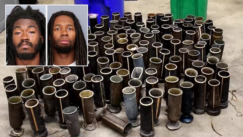 Two men are accused of stealing more than 100 bronze vases from a Maryland cemetery.