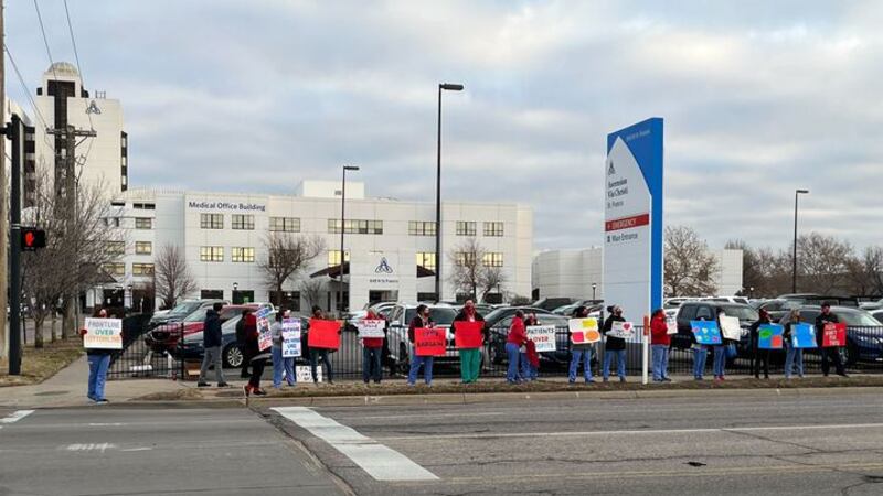 Nurses ralled outside Ascension Via Christi St. Francis on Wednesday following ahead of their...