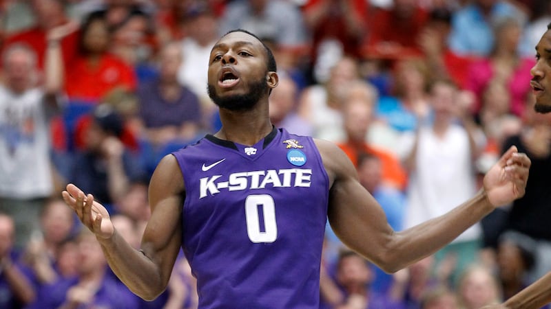 Kansas State's Jacob Pullen (0) celebrates breaking his school's all-time scoring record...